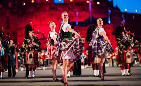 Highland dancers dance in front of the Edinburgh castle