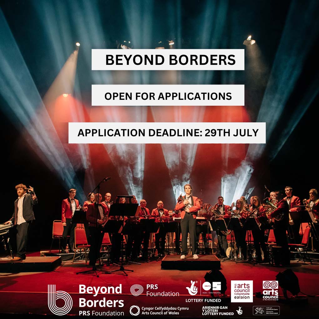 Beyond Borders Open For Applications. Application deadline 29th July. Image shows an orchestra dressed in formal red blazers. Behind them dramatic colours of white light and smoke rise up.
